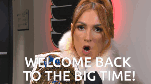 A Woman In A Fur Coat Is Holding A Wrestling Championship Belt And Says Welcome Back To The Big Time GIF