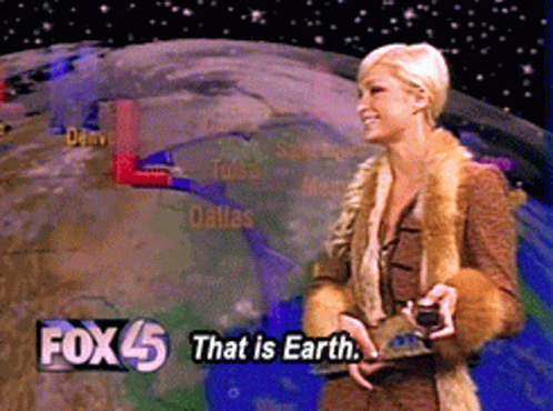 A Woman In A Fur Coat Stands In Front Of A Fox 45 That Is Earth Sign GIF