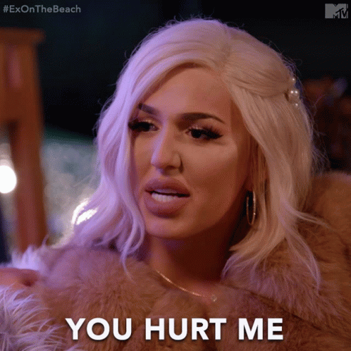 A Woman In A Fur Coat With The Words You Hurt Me Written Below Her GIF