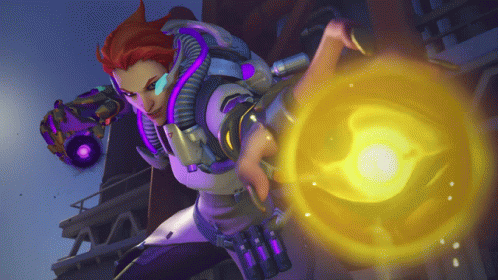 A Woman In A Futuristic Outfit Is Holding A Yellow Object In Her Hand GIF