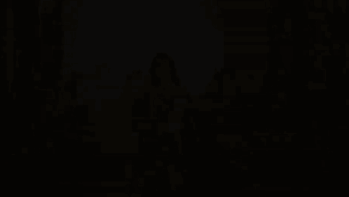 A Woman In A Gold Dress Is Surrounded By A Group Of Women GIF