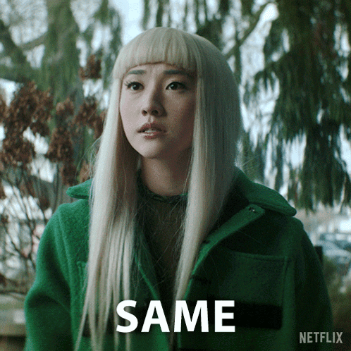 A Woman In A Green Coat Says Same GIF