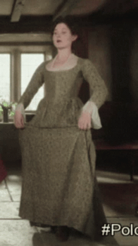 A Woman In A Green Dress With The Hashtag #Polo On The Bottom Right GIF