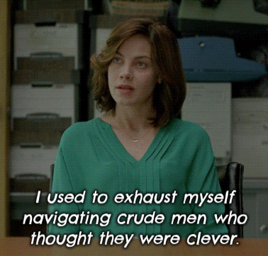 A Woman In A Green Shirt Is Sitting At A Desk And Says I Used To Exhaust Myself Navigating Crude GIF