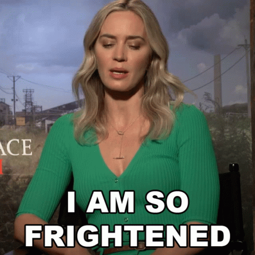 A Woman In A Green Sweater Says " I Am So Frightened " GIF