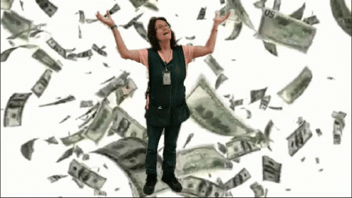 A Woman In A Green Vest Is Standing In Front Of A Pile Of Money That Is Falling From The Sky GIF
