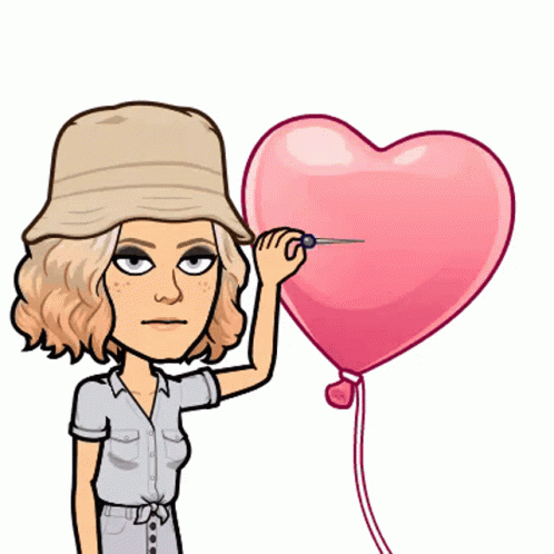 A Woman In A Hat Is Holding A Heart Shaped Balloon GIF