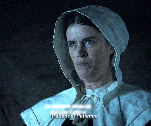 A Woman In A Hooded Cape Says Patience GIF