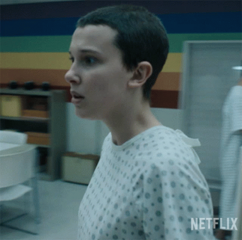 A Woman In A Hospital Gown With The Word Netflix On The Bottom GIF
