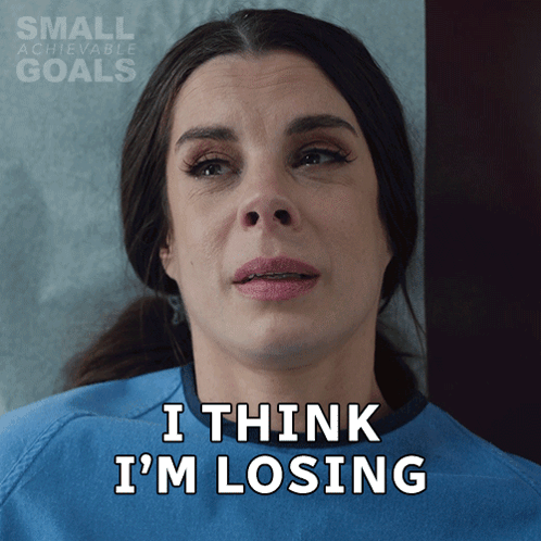 A Woman In A Hospital Gown With The Words I Think I 'M Losing On Her Face GIF
