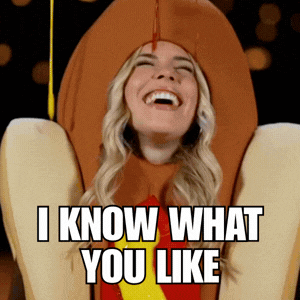 A Woman In A Hot Dog Costume Laughs And Says I Know What You Like GIF