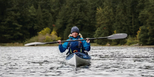 A Woman In A Kayak With A Paddle That Says Winner GIF