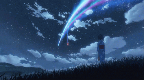 A Woman In A Kimono Stands In A Field Watching A Star Shine Through The Clouds GIF