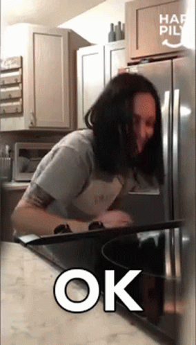 Woman In Kitchen With Ok Sign GIF