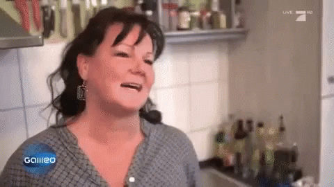 A Woman In A Kitchen With The Word Galileo On The Screen GIF