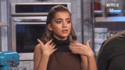 A Woman In A Kitchen With The Word Netflix On The Bottom GIF