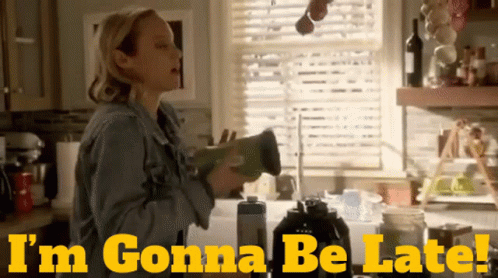 A Woman In A Kitchen With The Words " I 'M Gonna Be Late " On The Bottom GIF