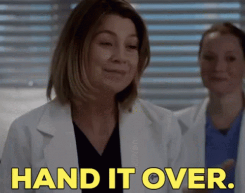 A Woman In A Lab Coat Is Saying " Hand It Over " GIF