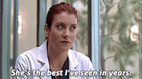 Woman In Lab Coat Sitting In Front Of Window Says She's The Best I've Seen GIF