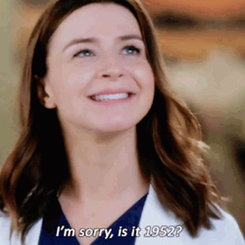 A Woman In A Lab Coat Is Smiling And Says " I 'M Sorry Is It 1952 " GIF