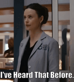 A Woman In A Lab Coat Is Standing In Front Of A Window And Says " I 'Ve Heard That Before " GIF