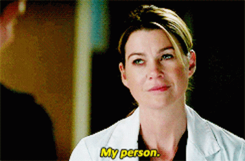 A Woman In A Lab Coat Is Talking About Her Person GIF