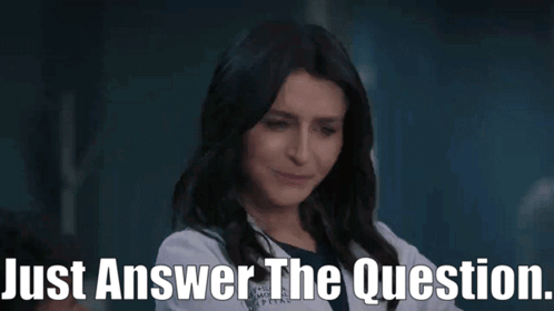 A Woman In A Lab Coat Is Talking To Someone And Says Just Answer The Question . GIF