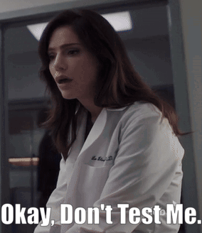 A Woman In A Lab Coat With The Words Okay Don 'T Test Me GIF