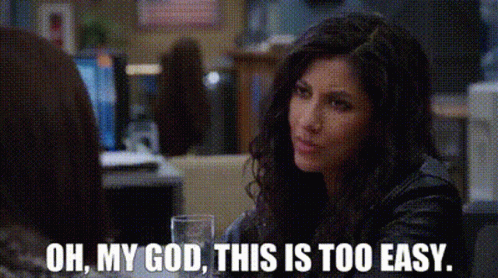 A Woman In A Leather Jacket Is Sitting At A Table With A Glass Of Water . GIF