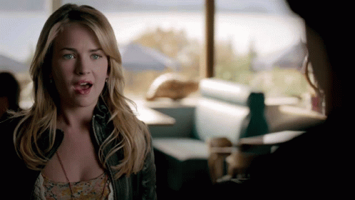 Woman In Diner Talking To Another Woman GIF