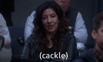 A Woman In A Leather Jacket Says Cackle GIF