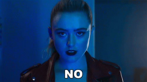 A Woman In A Leather Jacket With The Word No Written On Her Chest GIF