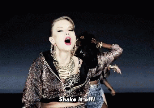 A Woman In A Leopard Print Jacket Says Shake It Off In A Video GIF