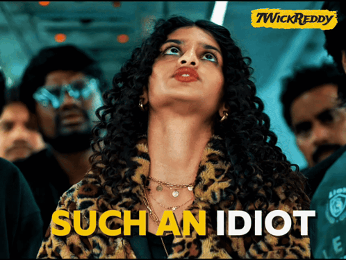 a woman in a leopard print jacket with the words such an idiot written on the bottom