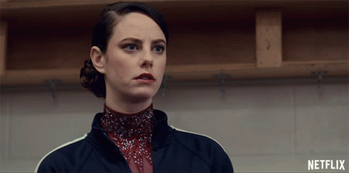 A Woman In A Locker Room With Netflix Written On The Bottom GIF