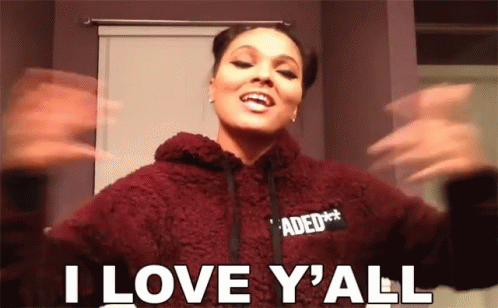 A Woman In A Maroon Hoodie Says I Love Y All GIF