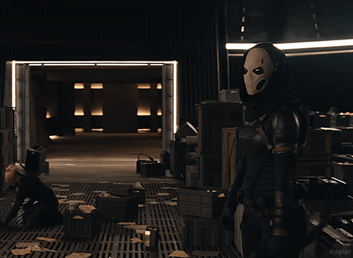 Woman In Mask Standing In Dark Room Kepler GIF