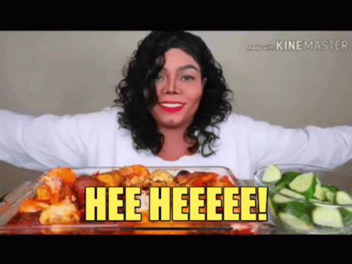 A Woman In A Michael Jackson Costume Is Eating A Casserole Dish Of Food With The Words Hee Heeeee On It GIF