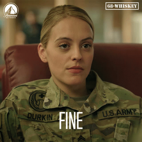 A Woman In A Military Uniform Has The Word Fine On Her Uniform GIF