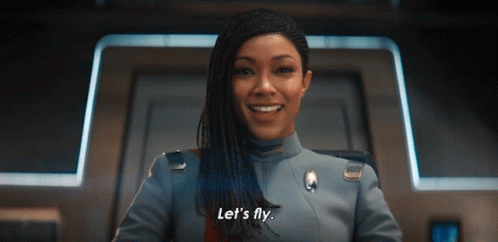 A Woman In A Military Uniform Says Let 'S Fly GIF