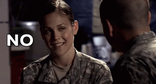 Woman In Military Uniform Smiling At Man With No Above Her GIF