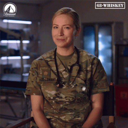 Woman In Military Uniform With Holloway Text GIF
