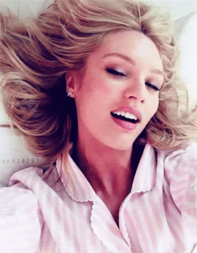 A Woman In A Pink And White Striped Shirt Has The Number Ann14797 On The Bottom GIF