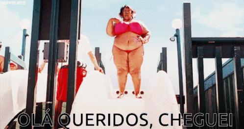 A Woman In A Pink Bikini Is Standing On A Slide With The Words Ola Queridos Cheguei Written On The Bottom GIF