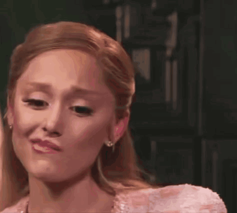 A Woman In A Pink Dress Is Crying . GIF