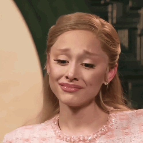 A Woman In A Pink Dress Is Crying GIF