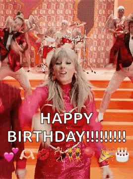 A Woman In A Pink Dress Is Dancing On A Stage In Front Of A Group Of People . GIF