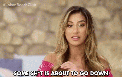 A Woman In A Pink Dress Is Saying Some Shit Is About To Go Down . GIF