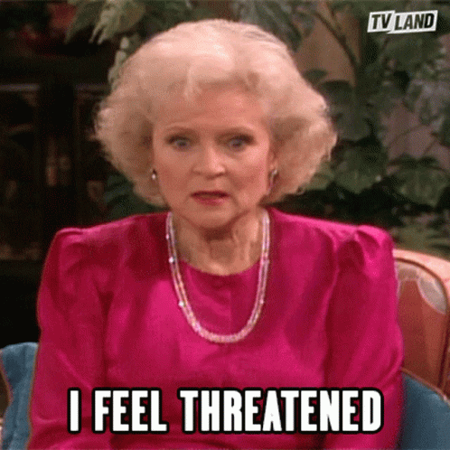 Woman In Pink Dress Says I Feel Threatened GIF