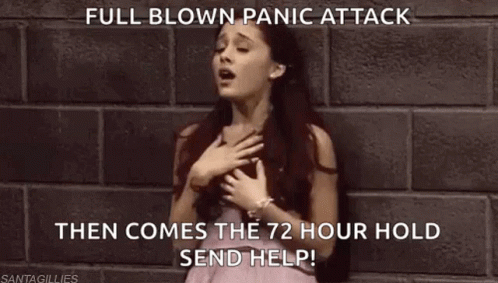 A Woman In A Pink Dress Is Standing In Front Of A Brick Wall With Her Hand On Her Chest . GIF
